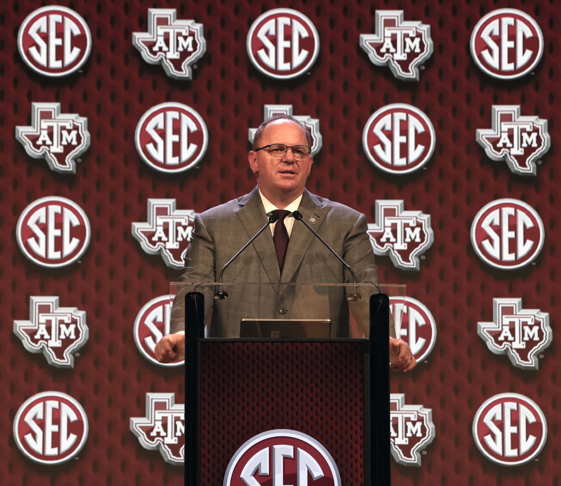 Texas A&M head football coach Mike Elko listens to a question from a media member during the...