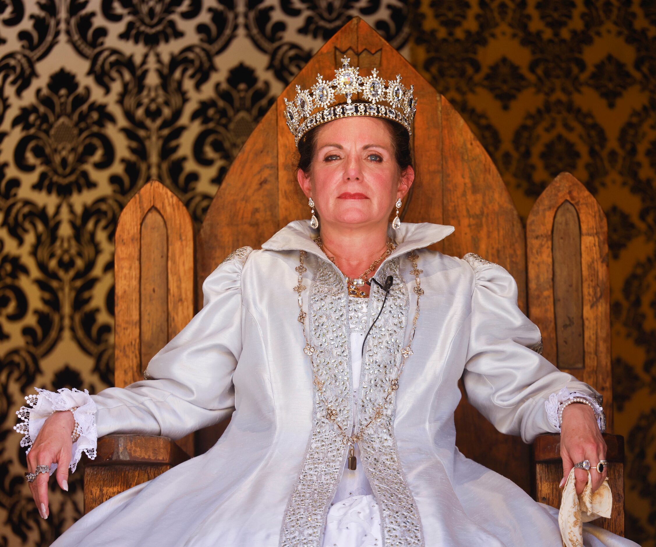 Actress Janna Zepp, playing Queen Catherine Parr sits by King Henry VIII on the throne...