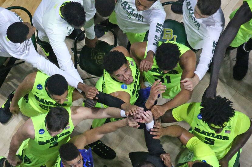 The Baylor team gathers together during a time out in the first half during the USC Trojans...