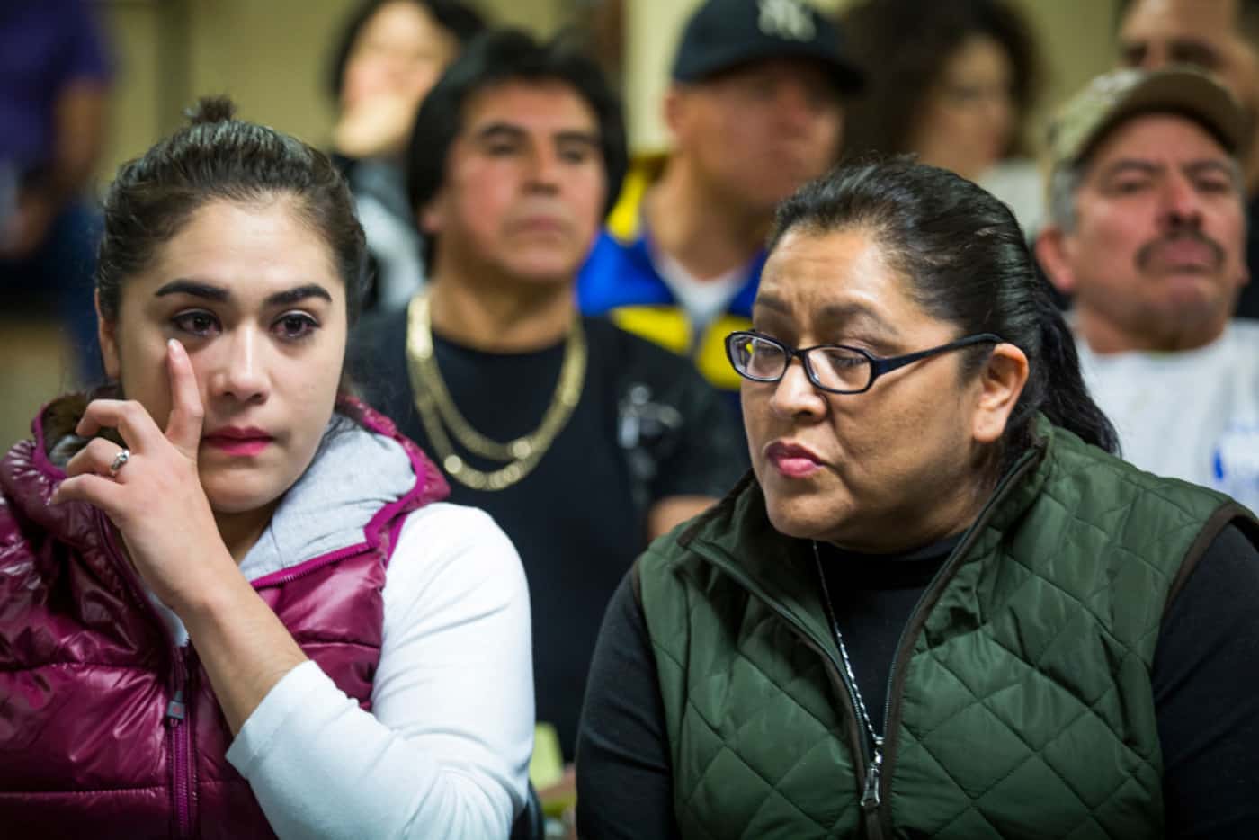 Rosa Guadalupe Torres (left) wipes away a tear as she and her mother Marta Macias talk about...