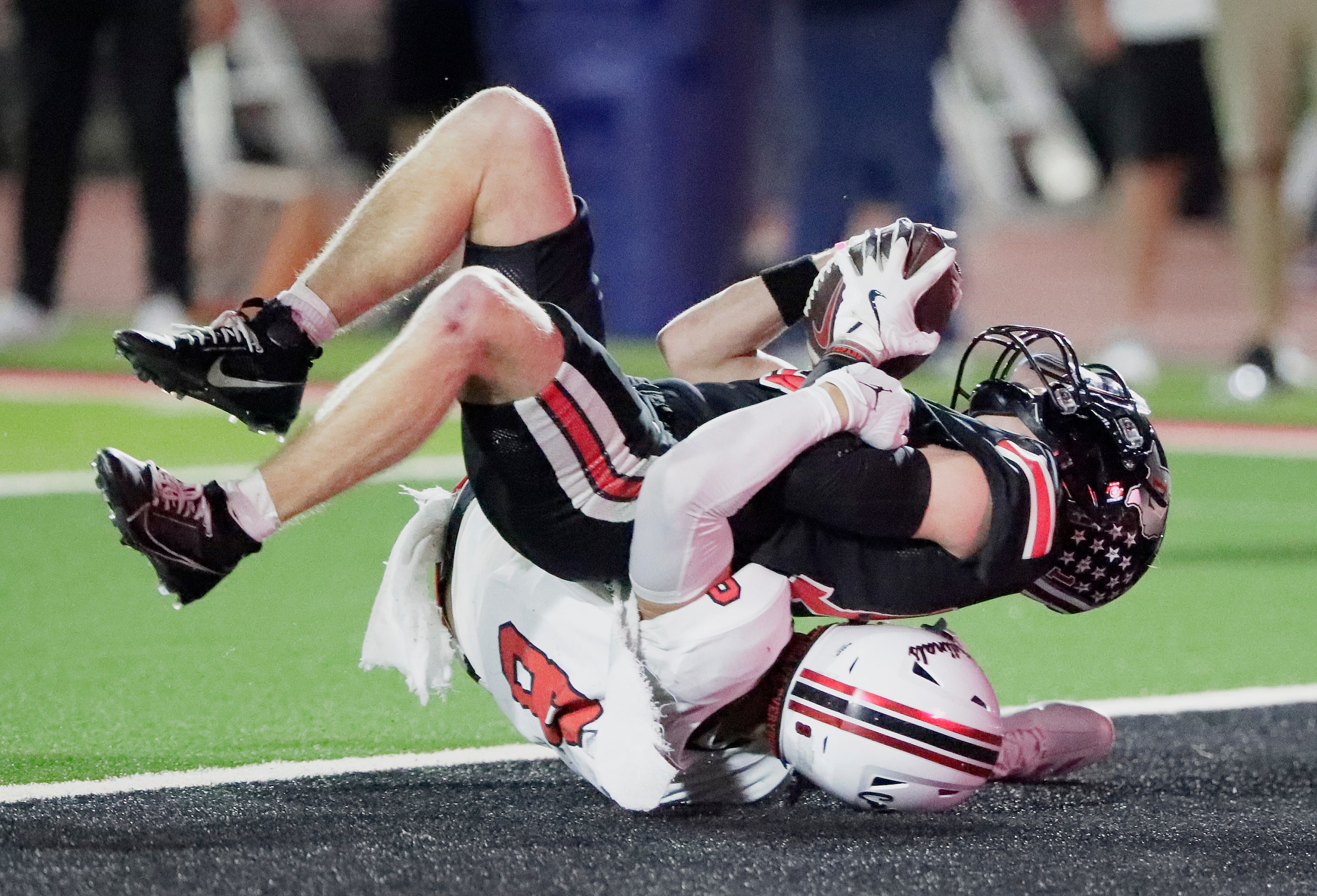 Lovejoy High School wide receiver Zane Kuzenski (13) comes down with a touchdown catch on...