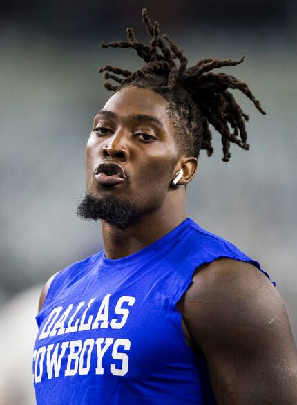 Dallas Cowboys defensive end Demarcus Lawrence (90) warms up before an NFL game between the...