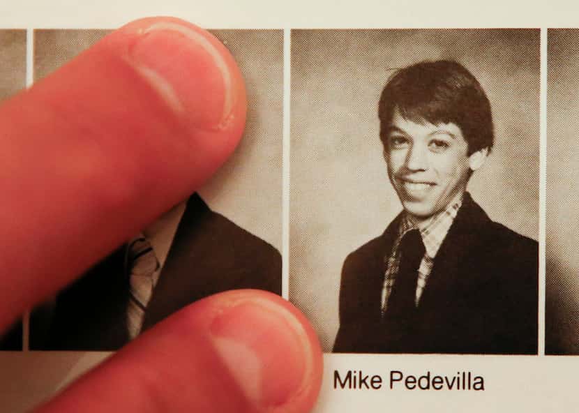 Mike Pedevilla shows a yearbook photo from his freshman year at Jesuit College Preparatory...