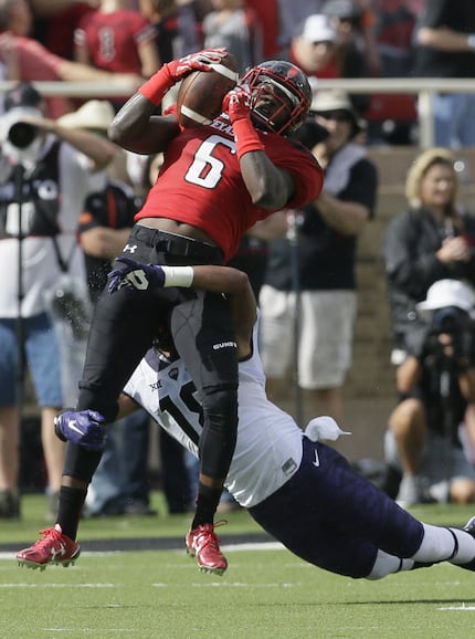 Texas Tech wide receiver Devin Lauderdale (6) catches a pass against TCU safety Nick Orr...