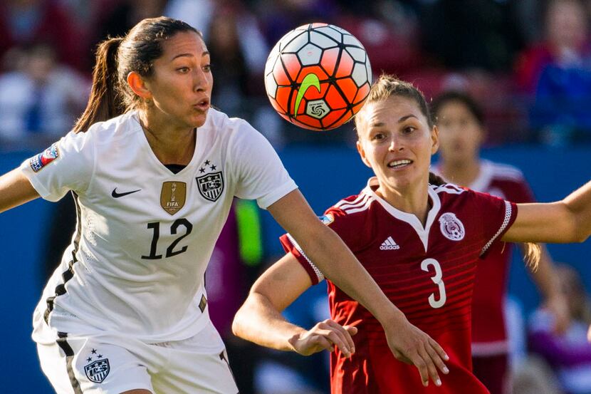United States forward Christen Press (12) and Mexico defender Janelly Farias (3) go for the...