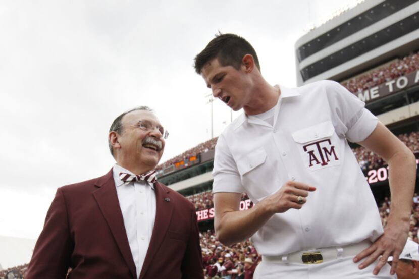 “He’s very connected to the student body,” senior yell leader David Benac (right) said of...