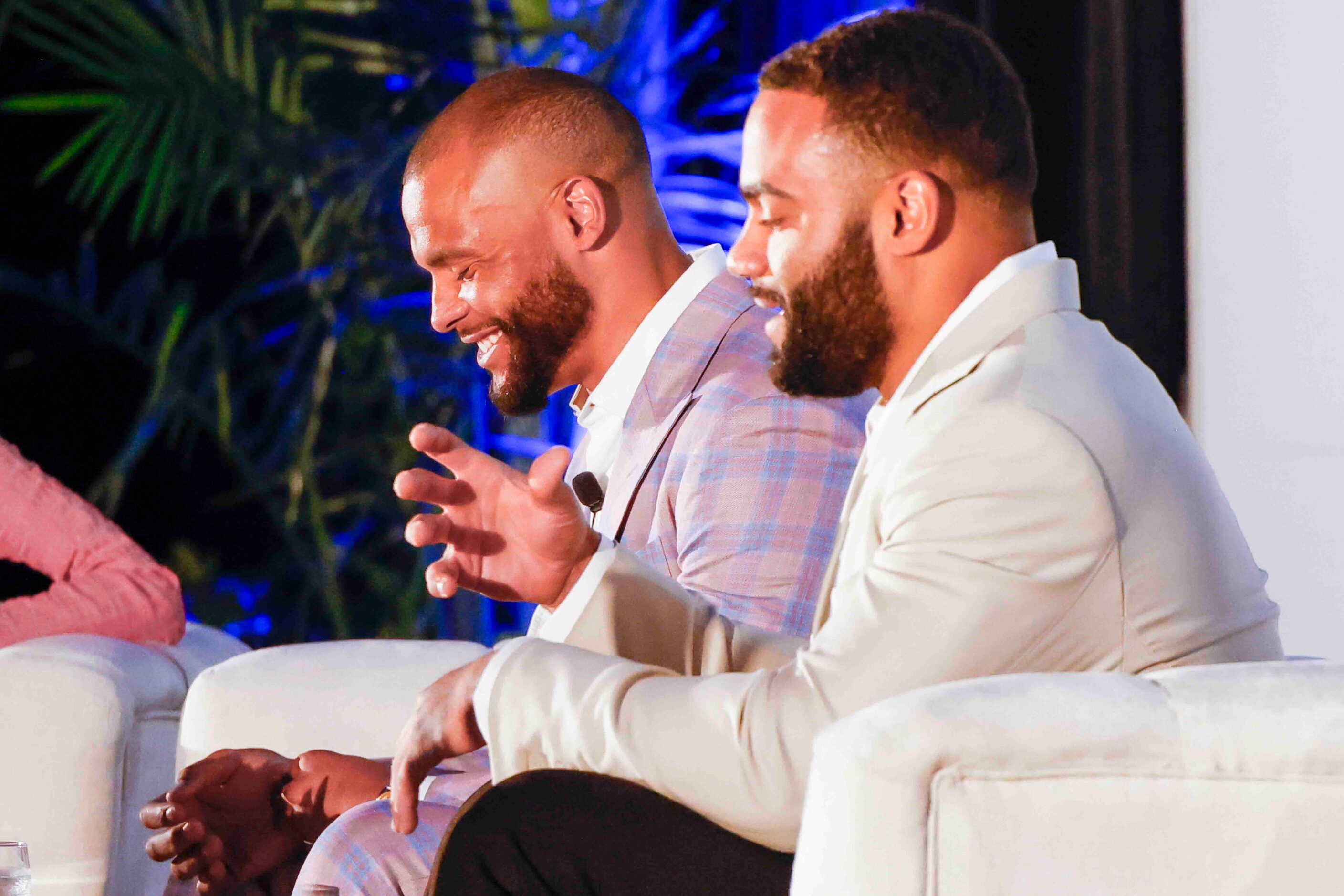 Cowboys QB Dak Prescott (left) shares a laugh while listening to Solomon Thomas of the New...