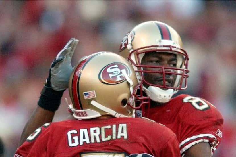 ORG XMIT: *S0405142325* San Francisco 49ers wide receiver Terrell Owens, right, hugs 49ers...