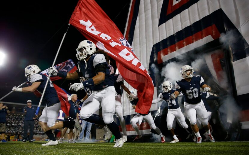 Allen football players take the field against Plano East at Eagle Stadium on Friday, Nov. 6,...