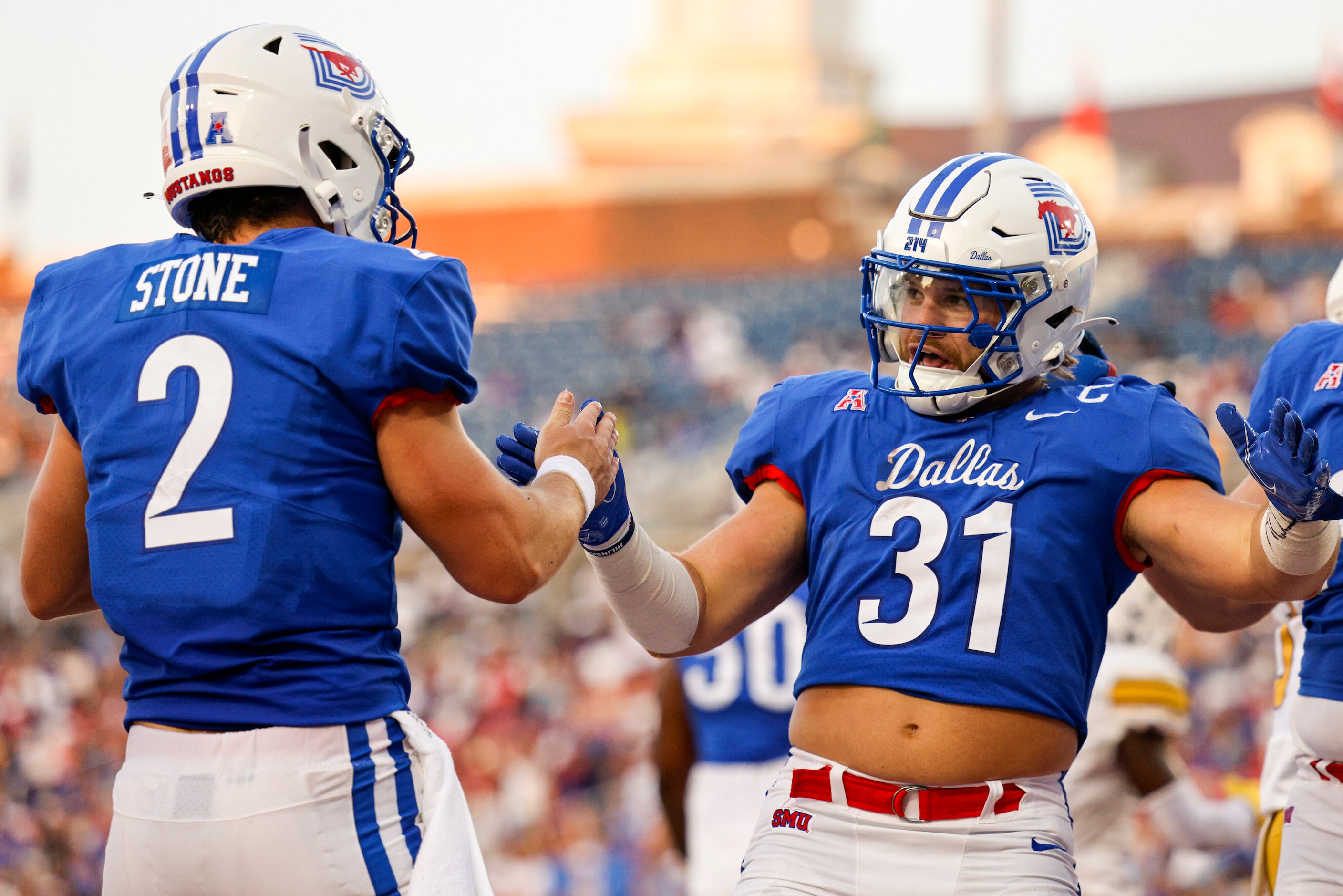 SMU quarterback Preston Stone (2) celebrates his touchdown with SMU running back Tyler...