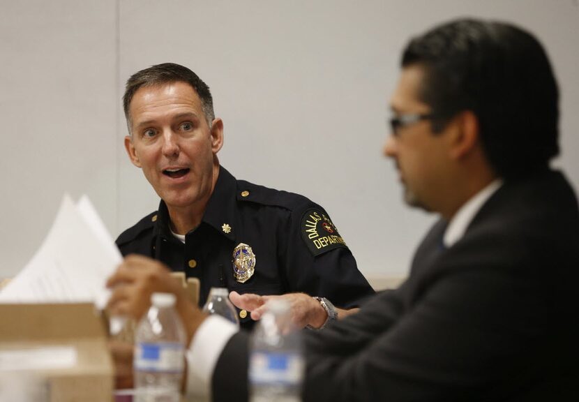 Deputy Police Chief Rob Sherwin, talking to Dallas County Criminal Court Judge Roberto Canas...