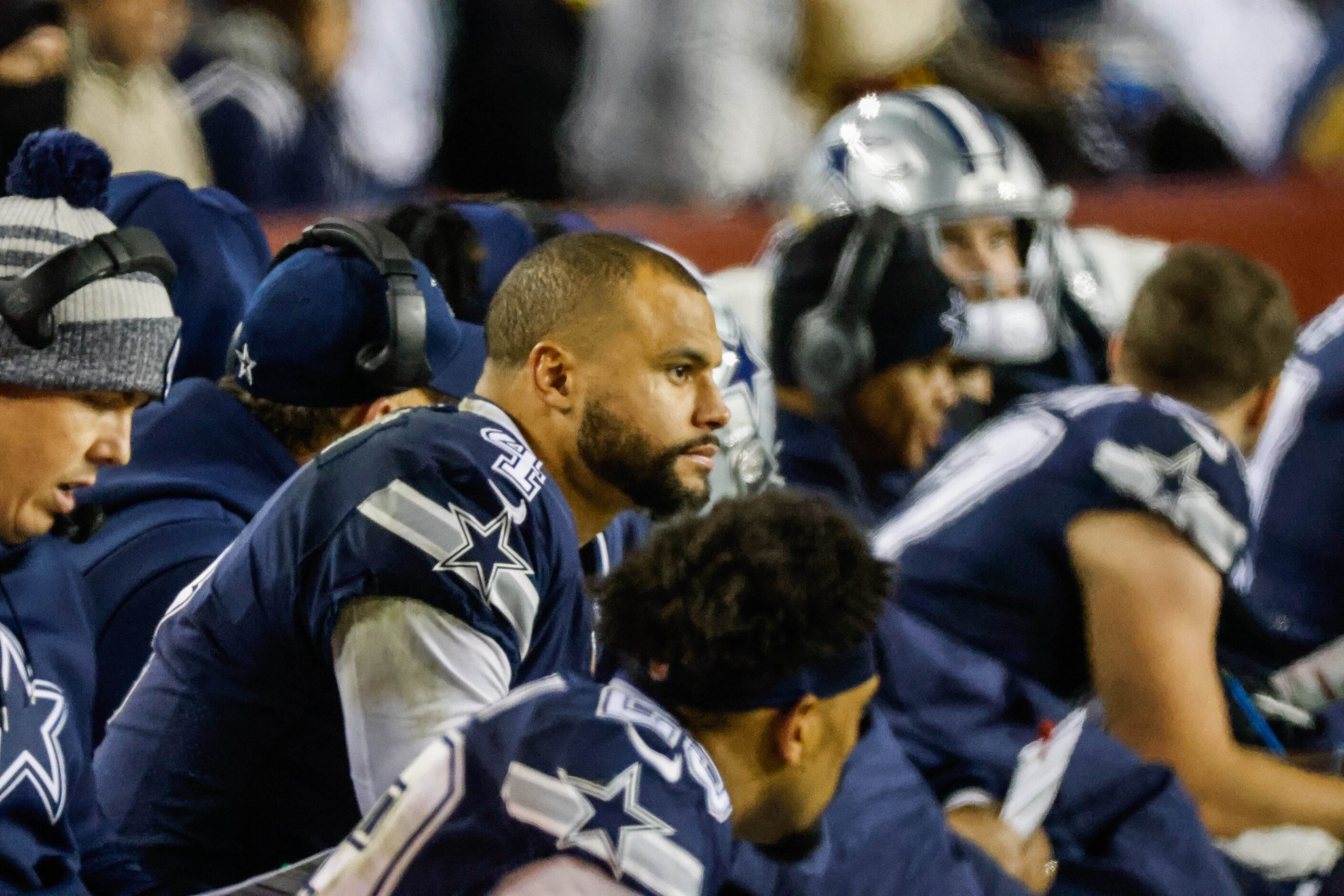 Dallas Cowboys quarterback Dak Prescott (4) watches the team play against Washington...