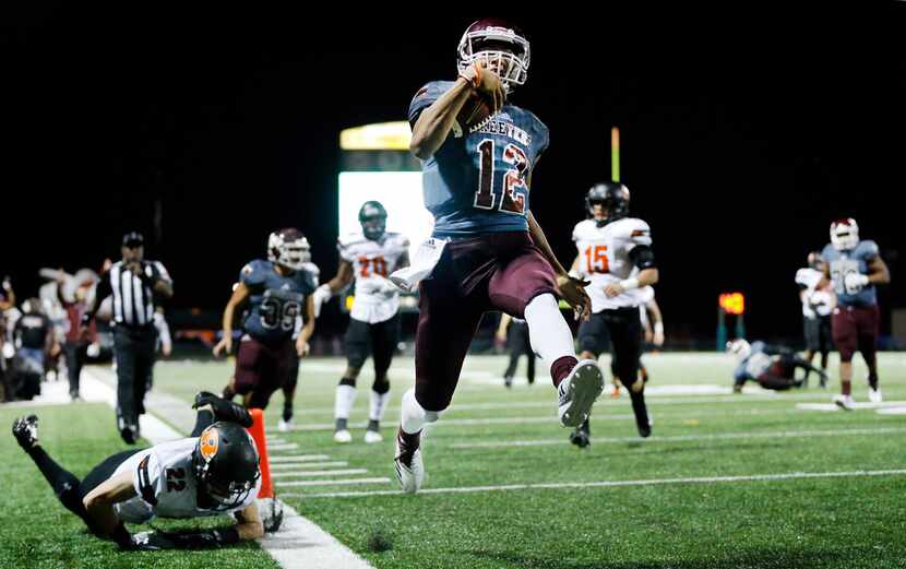 Mesquite quarterback Dylan McGill (12) skips through the end zone, scoring a second quarter...