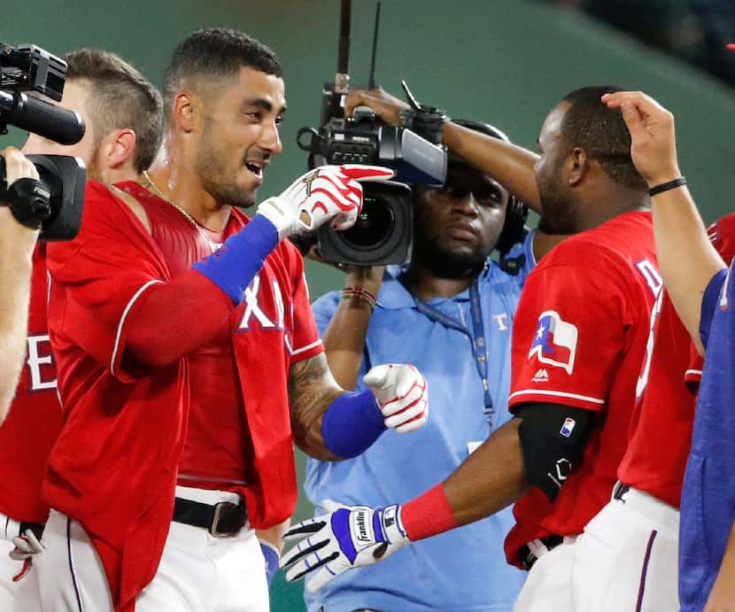 Rangers center fielder Ian Desmond (20), left, is pictured during the Los Angeles Angels vs....