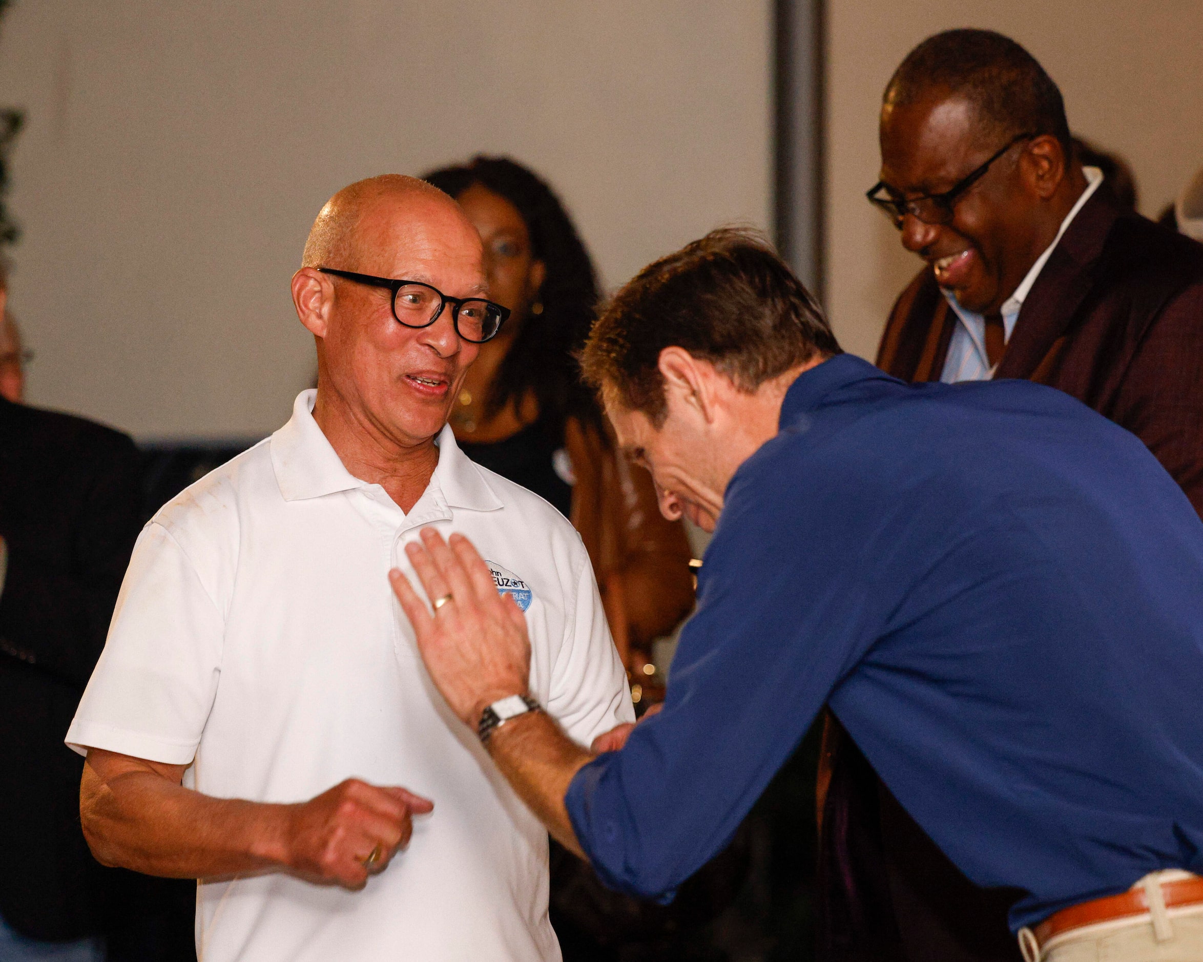 Dallas County District Attorney John Creuzot (left) laughs with State Sen. Nathan Johnson at...