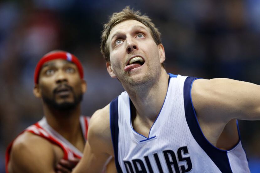 Dallas Mavericks forward Dirk Nowitzki (41) looks to get a rebound on a Houston Rockets free...
