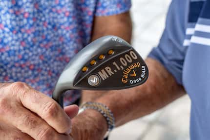 Doug Bolls of Trophy Club was presented with a specially stamped wedge with "Mr. 1000" and...