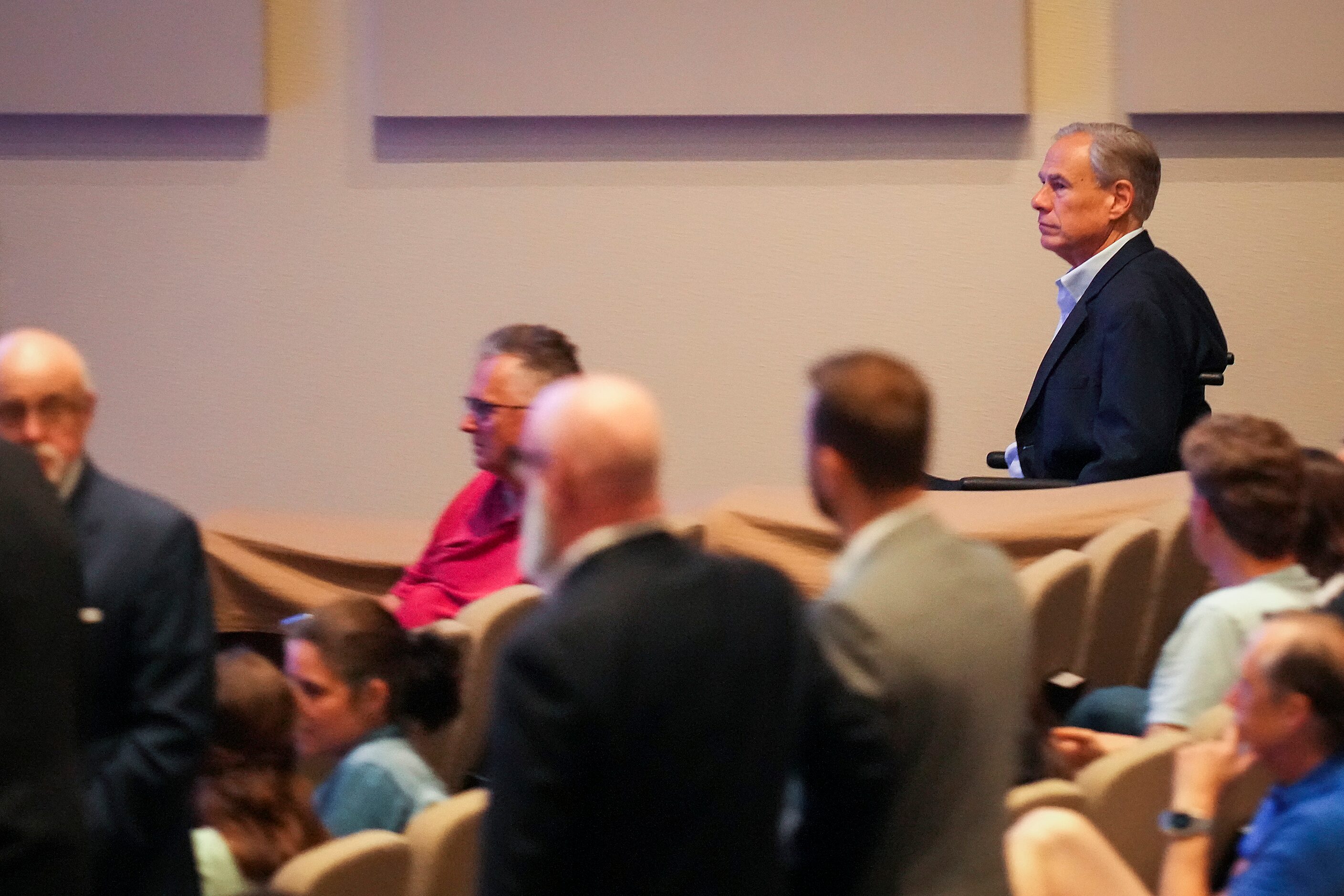 Texas Gov. Greg Abbott arrives for a vigil at Cottonwood Creek Church a day after a mass...