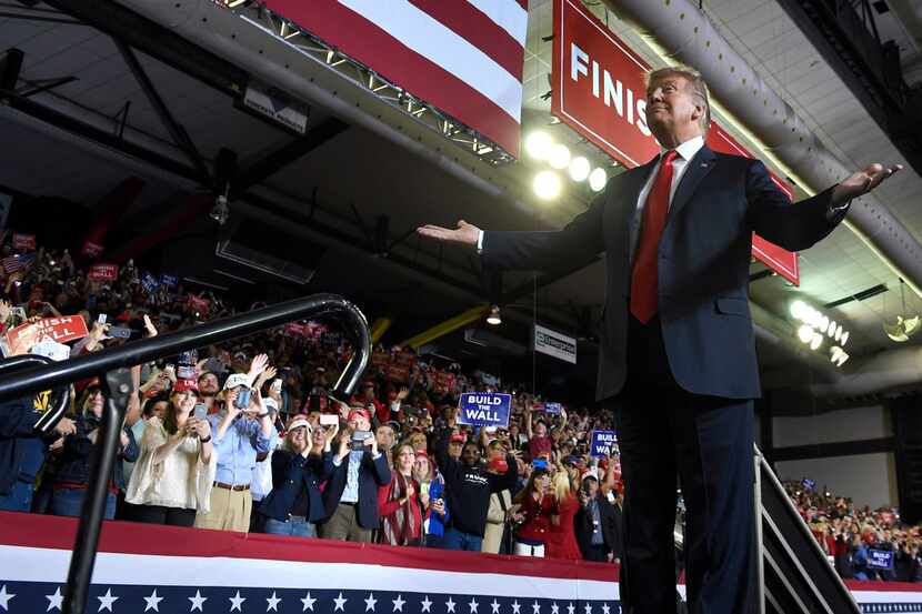 President Donald Trump gestures to the crowd as he speaks during a rally in El Paso on Feb. 11.