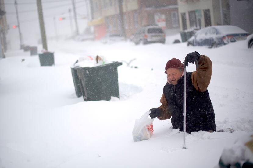 ATLANTIC CITY, NJ:  Thom Meyers, 67, trudges with a cane through snow covered streets on...