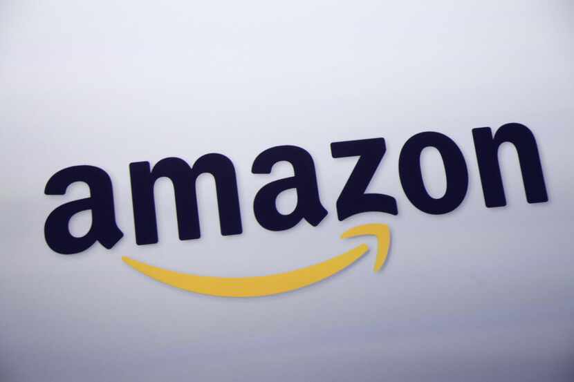 FILE - This Sept. 28, 2011 file photo shows the Amazon logo on display at a news conference...