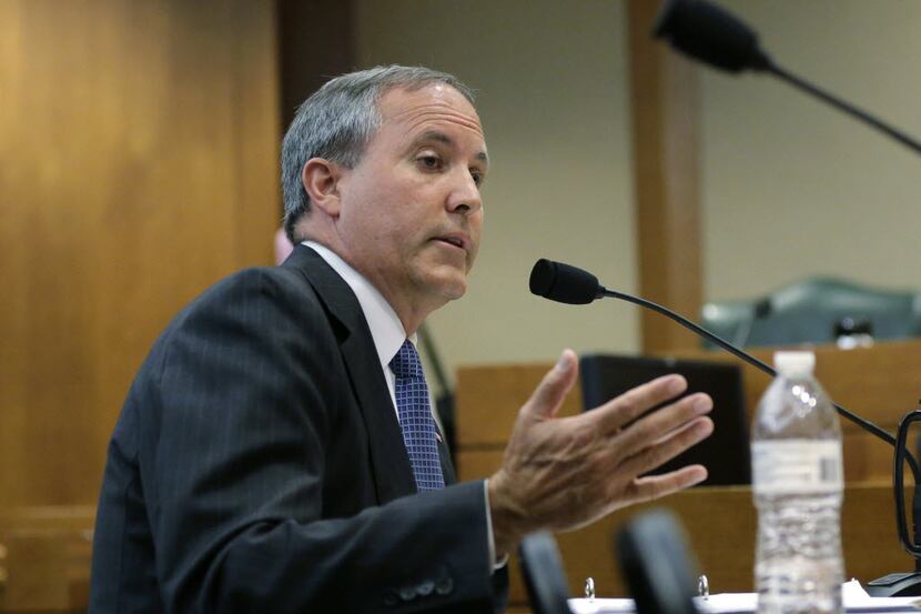  Texas Attorney General Ken Paxton speaks during a hearing in Austin in July. (AP Photo/Eric...