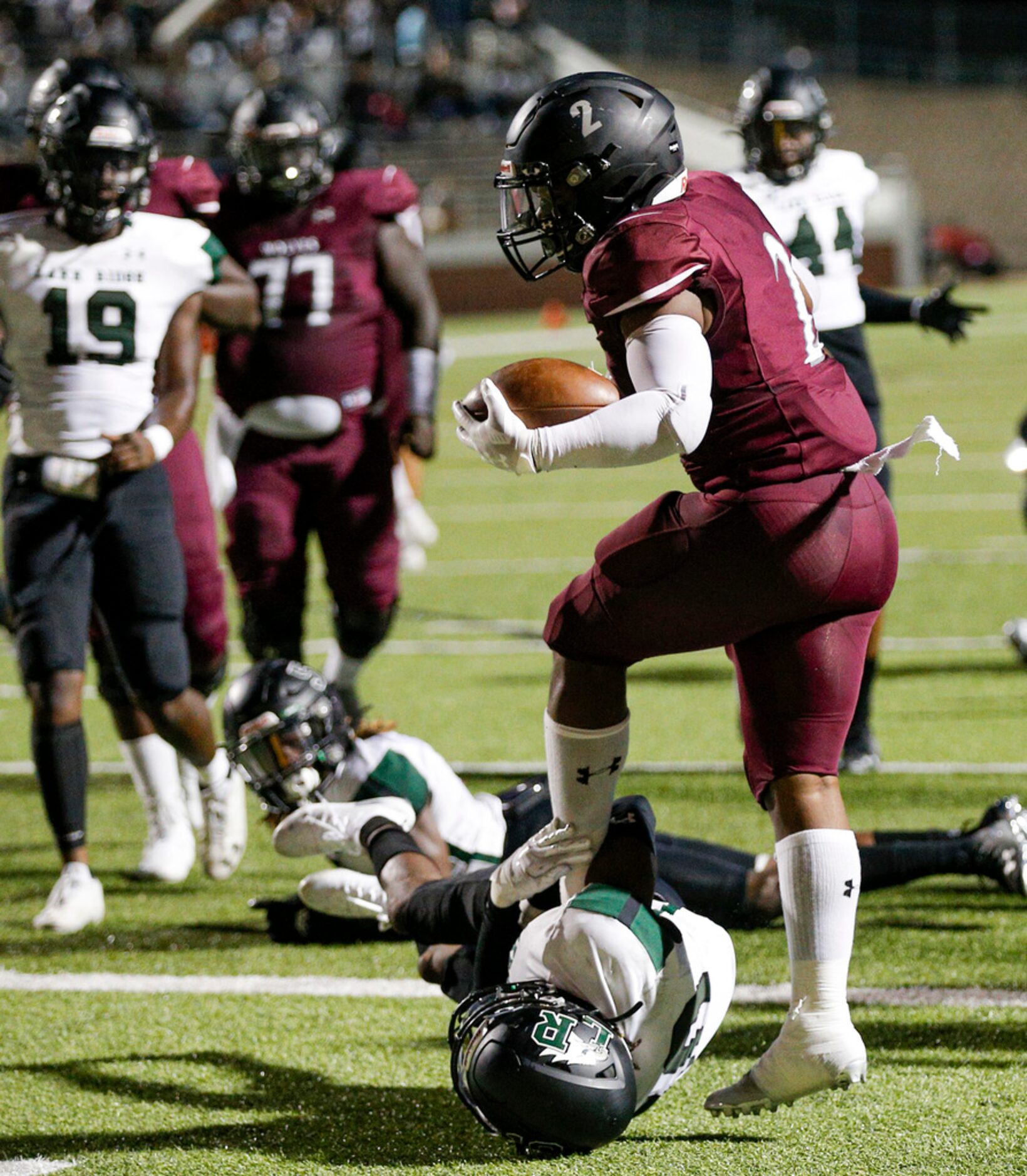 TXHSFB Mansfield Timberview junior running back Deuce Jones (2) scores a touchdown as...