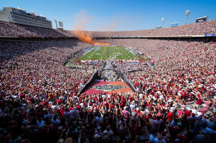 The Texas Longhorns take the field before an NCAA college football game against Oklahoma at...