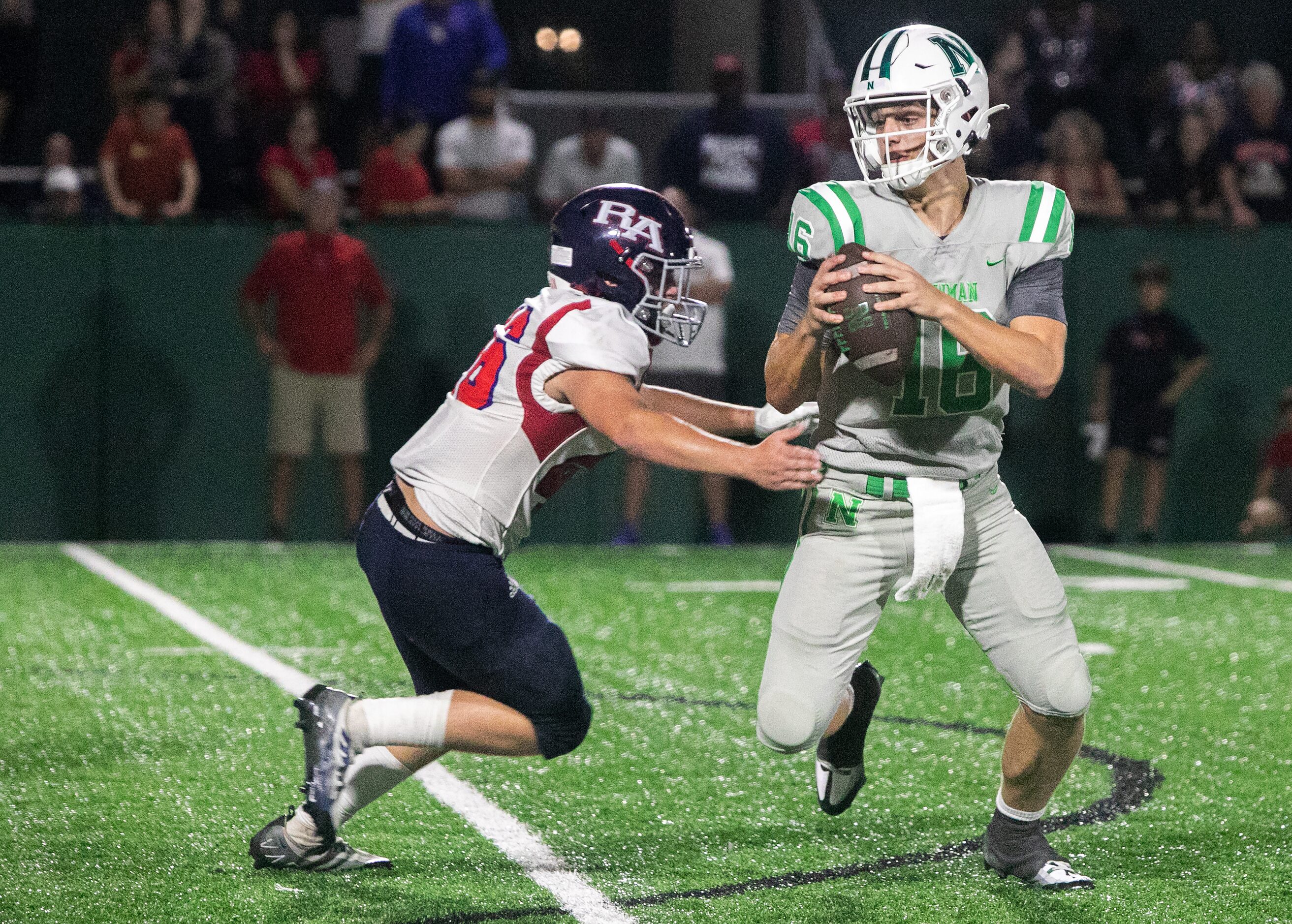 Arch Manning scrambles as his protection breaks down as Newman High School takes on...