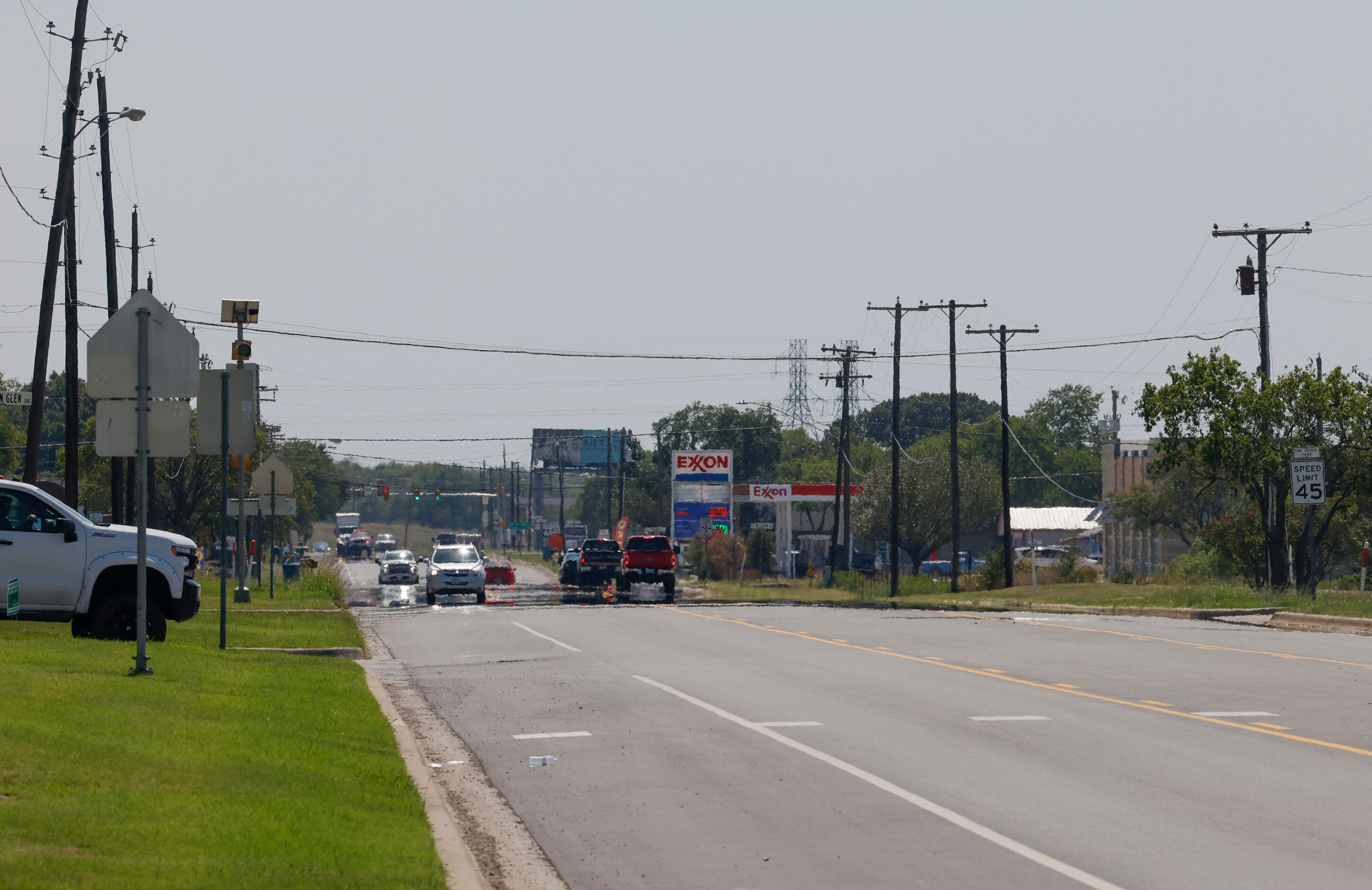 Traffic passes along Preston Road.