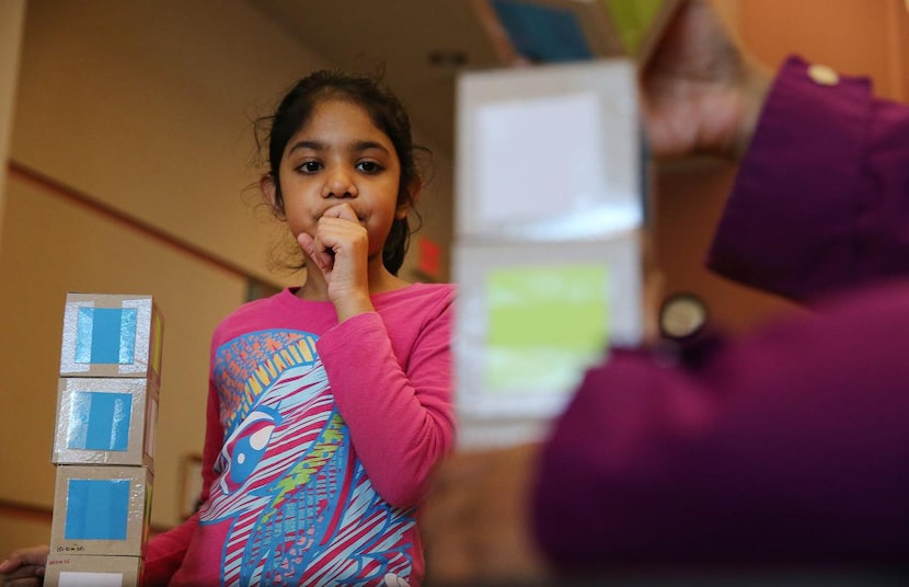 
Aarushi watches as her mother solves the Instant Insanity puzzle. Since September, more...