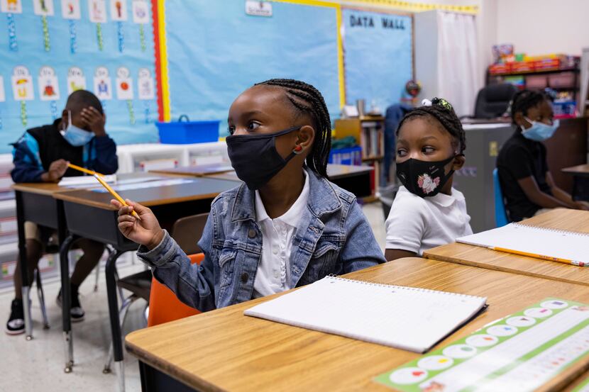 Zaniyah Mitchem, 6, asks Ms. Johnson if she can grab her iPad during her first grade general...