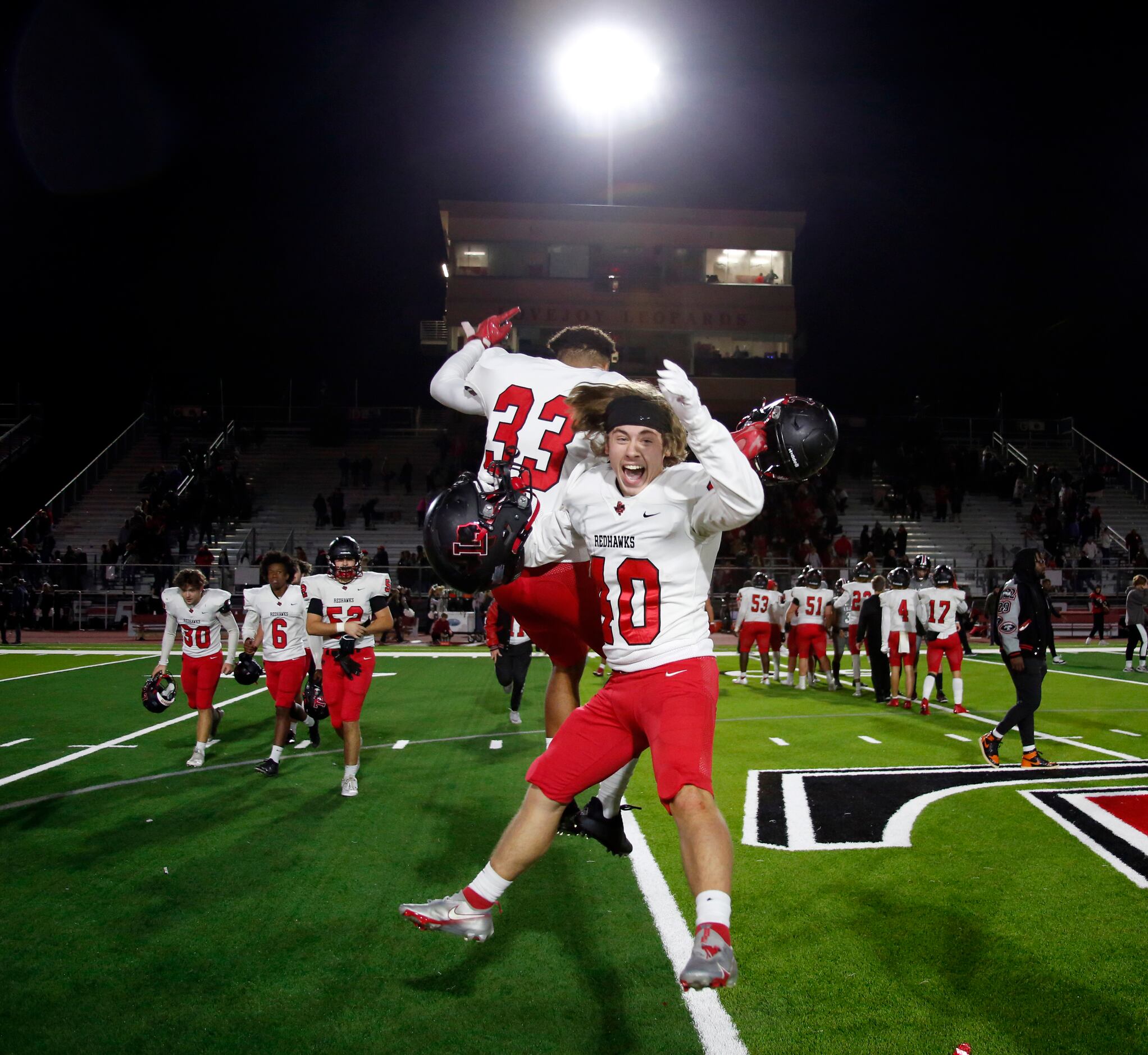 Frisco Liberty players sky at midfield in celebration following the Redhawks' 27-24 victory...