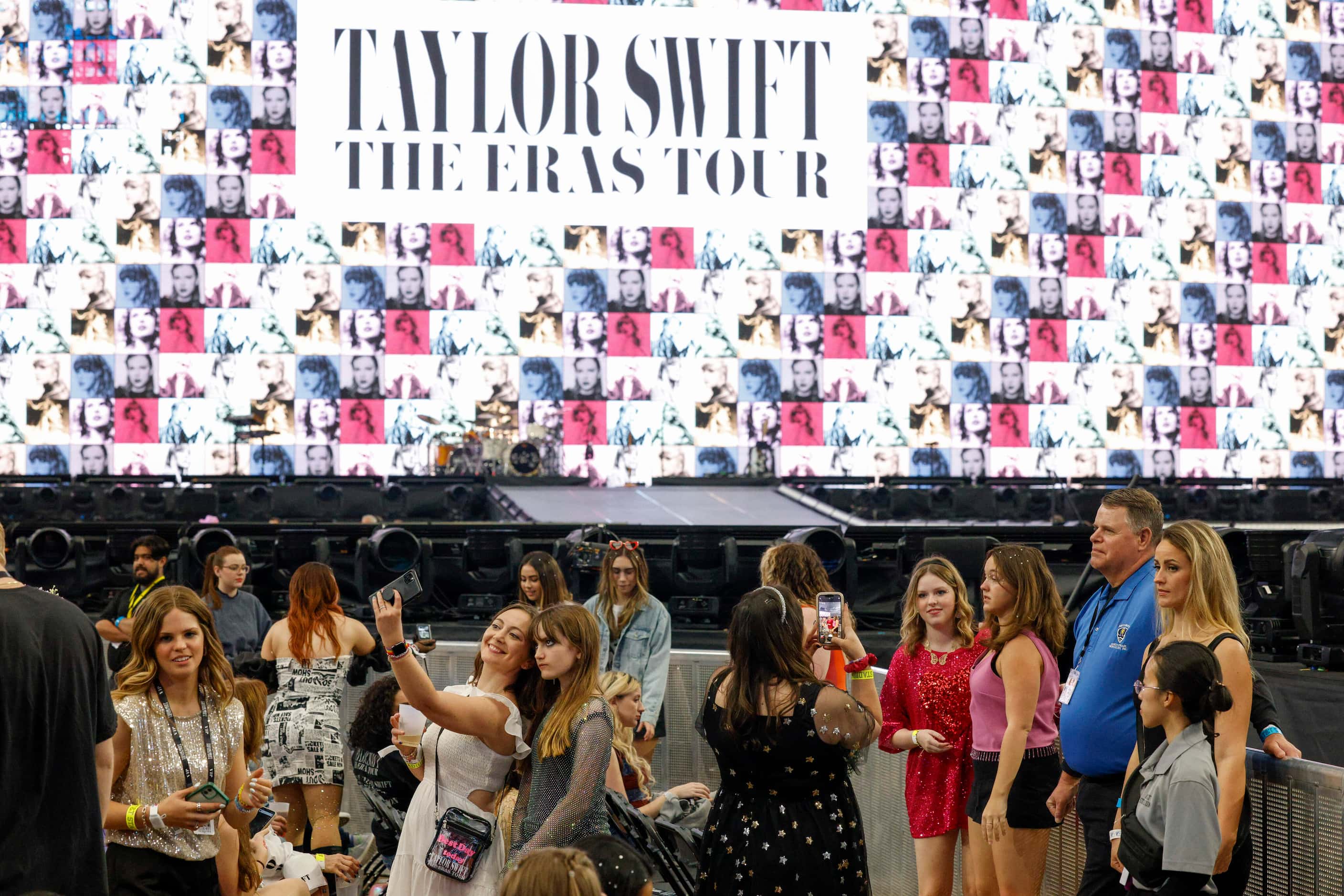 Fans take photos before Taylor Swift performs at the Eras Tour concert at AT&T Stadium on...