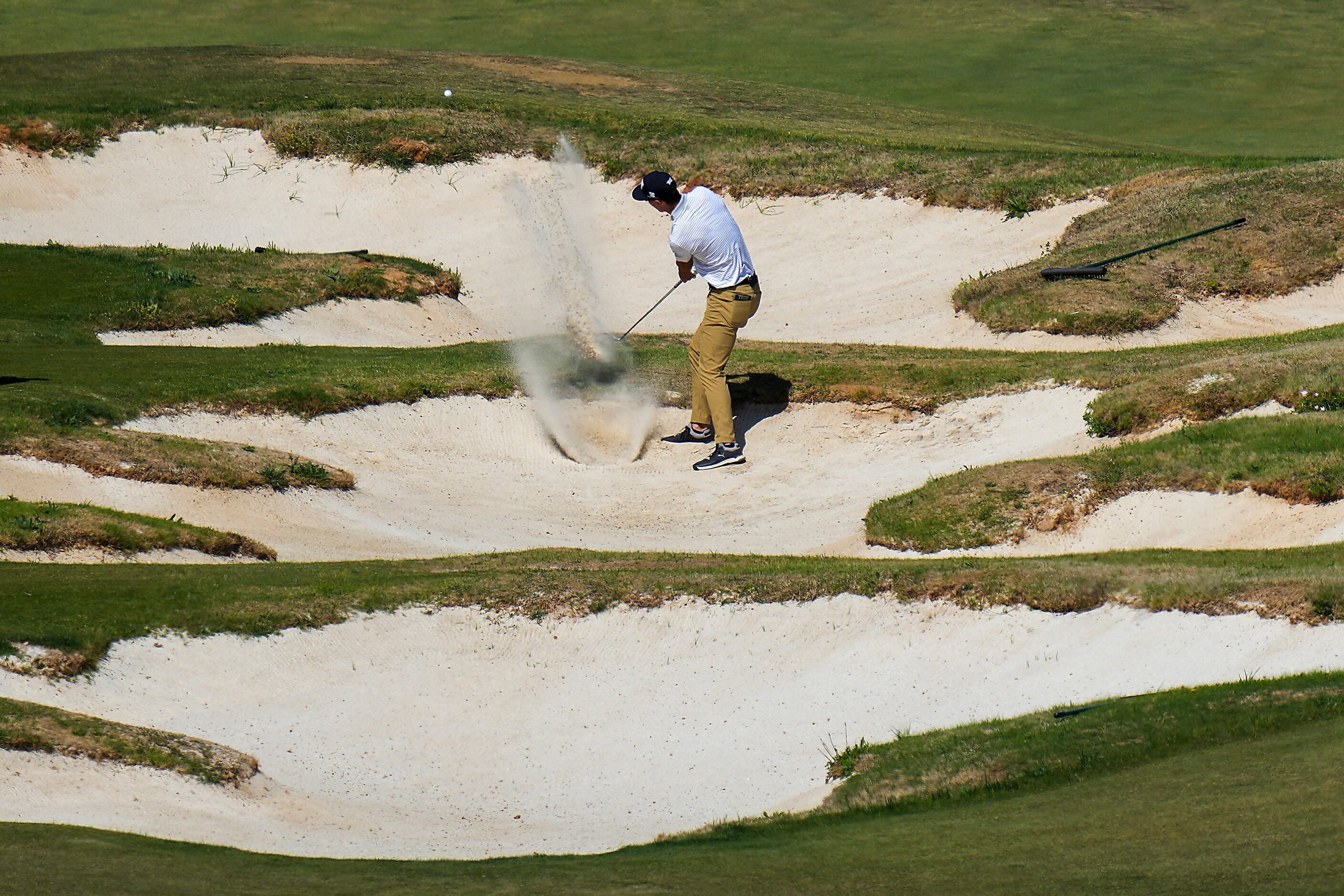 Seth Reeves hits from a bunker on the 14th hole during the final round of the Korn Ferry...