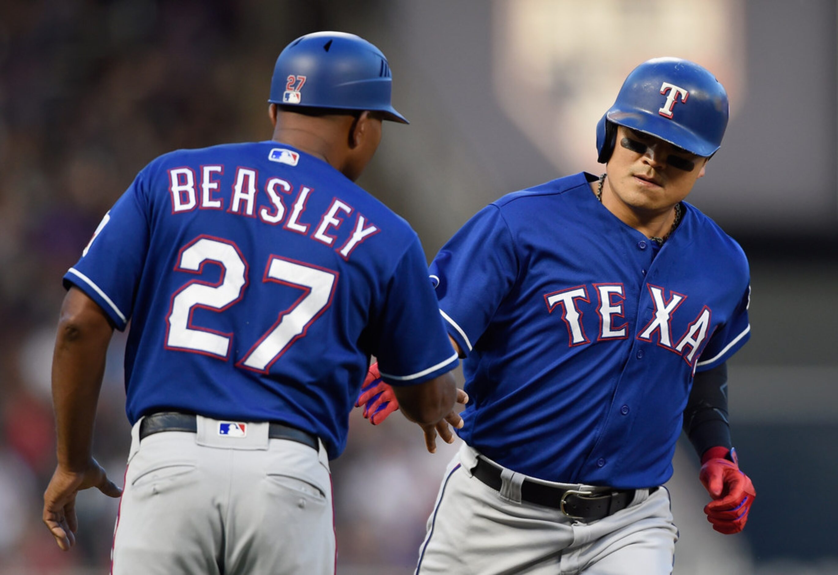 MINNEAPOLIS, MN - JUNE 22: Third base coach Tony Beasley #27 of the Texas Rangers...