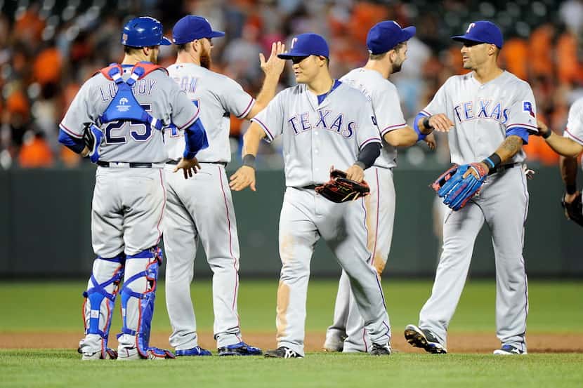 BALTIMORE, MD - AUGUST 04:  The Texas Rangers celebrate after a 5-3 victory against the...