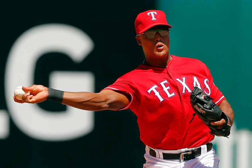 Texas Rangers third baseman Adrian Beltre (29) throws to first for a Seattle Mariners out at...