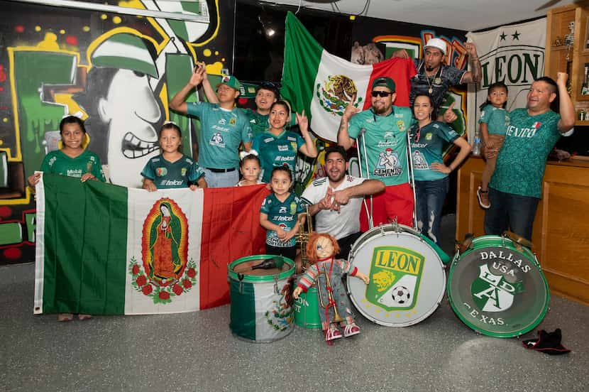 A group of Mexican soccer fans pose for a photo with family on Friday night, May 17, 2024 in...