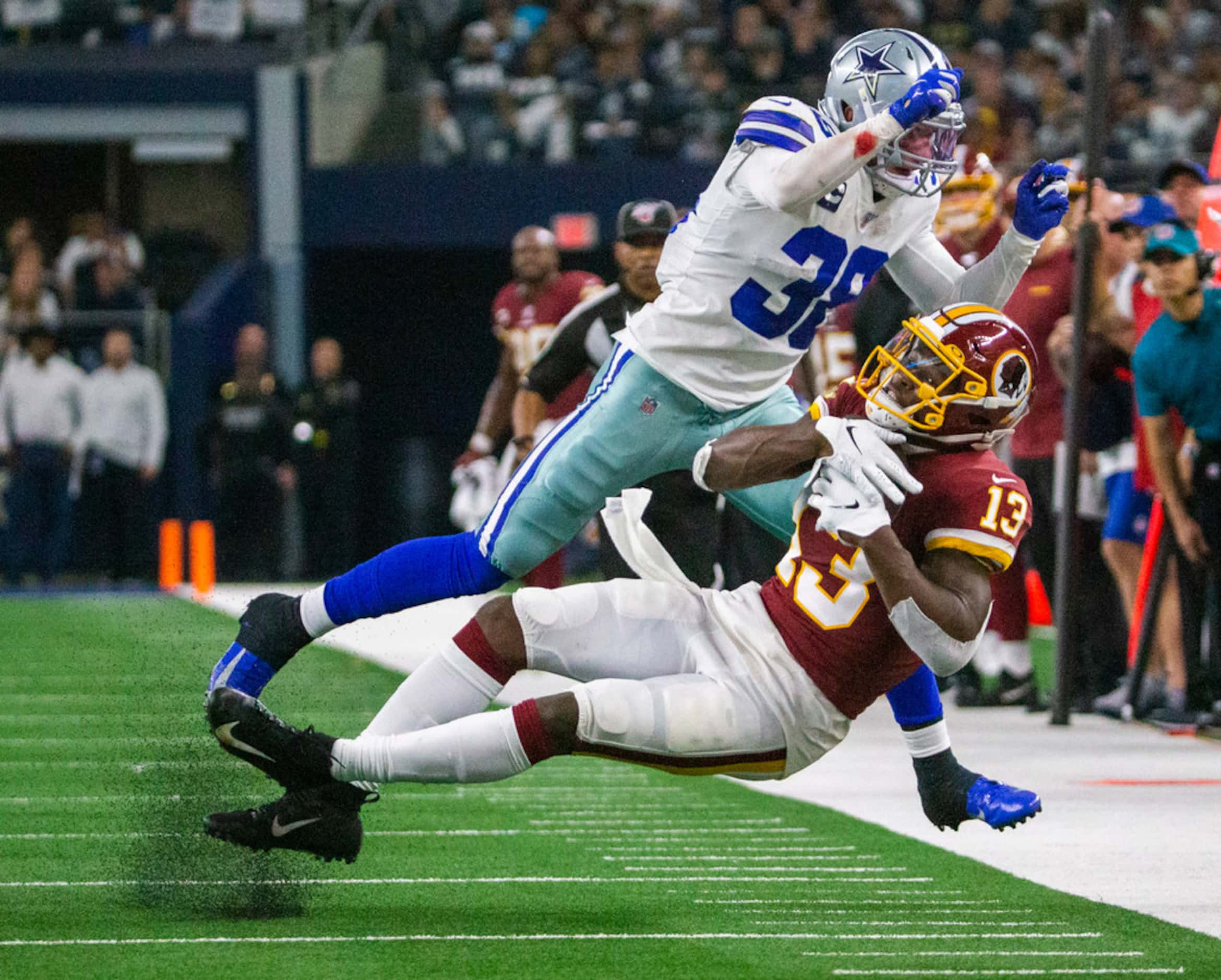 Dallas Cowboys strong safety Jeff Heath (38) tackles Washington Redskins wide receiver...