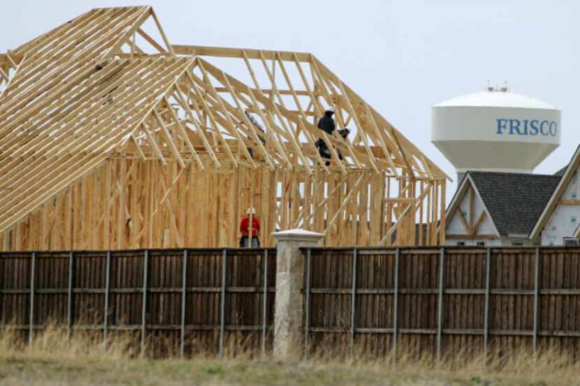 Homes under construction in the Park Place development in Frisco are likely to carry a...