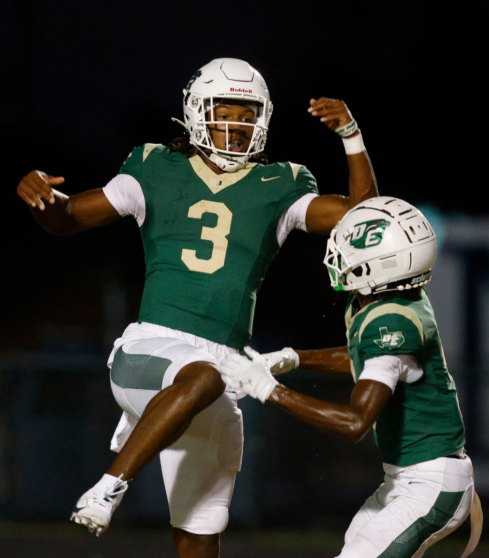 DeSoto's Kelden Ryan (3) celebrates with his teammate Kristoff Fantroy (9) after scoring a...