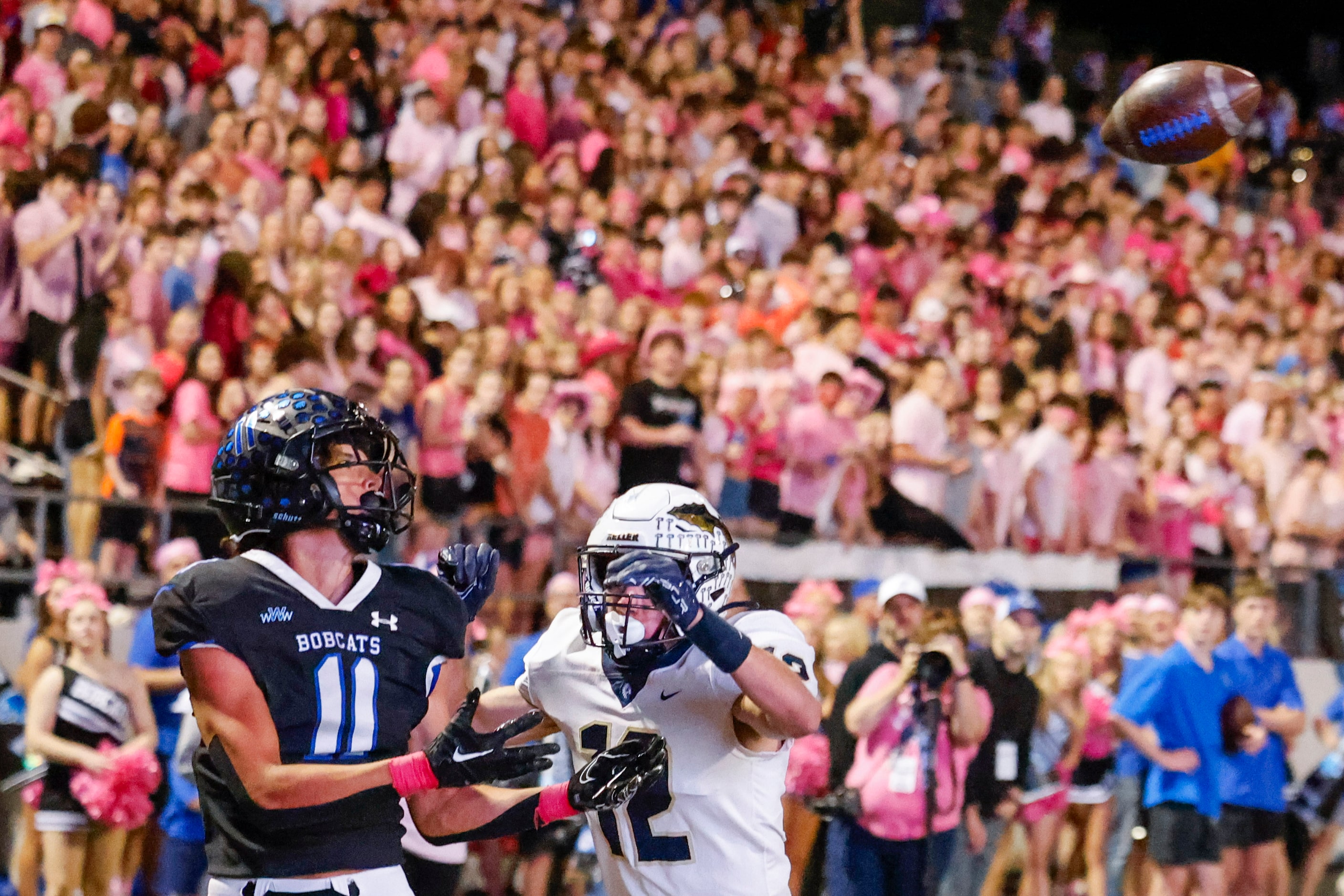 Byron Nelson High School’s Leo Almanza (11) reaches for a touchdown pass reception past...