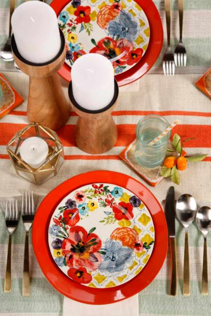 
Bold Sissinghurst stoneware salad plates ($14) from Anthropologie are paired with fiery...