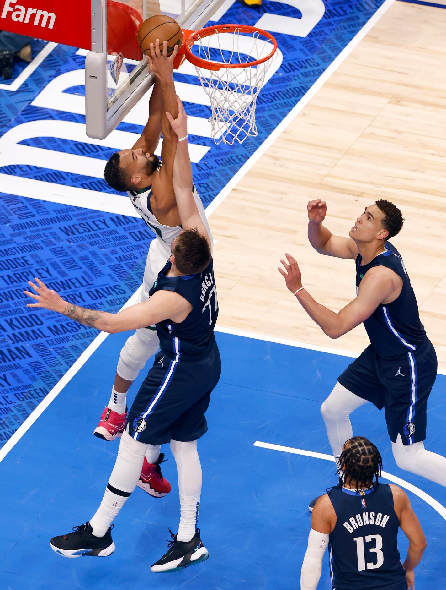 Dallas Mavericks guard Luka Doncic (77) makes contact with Utah Jazz center Rudy Gobert (27)...