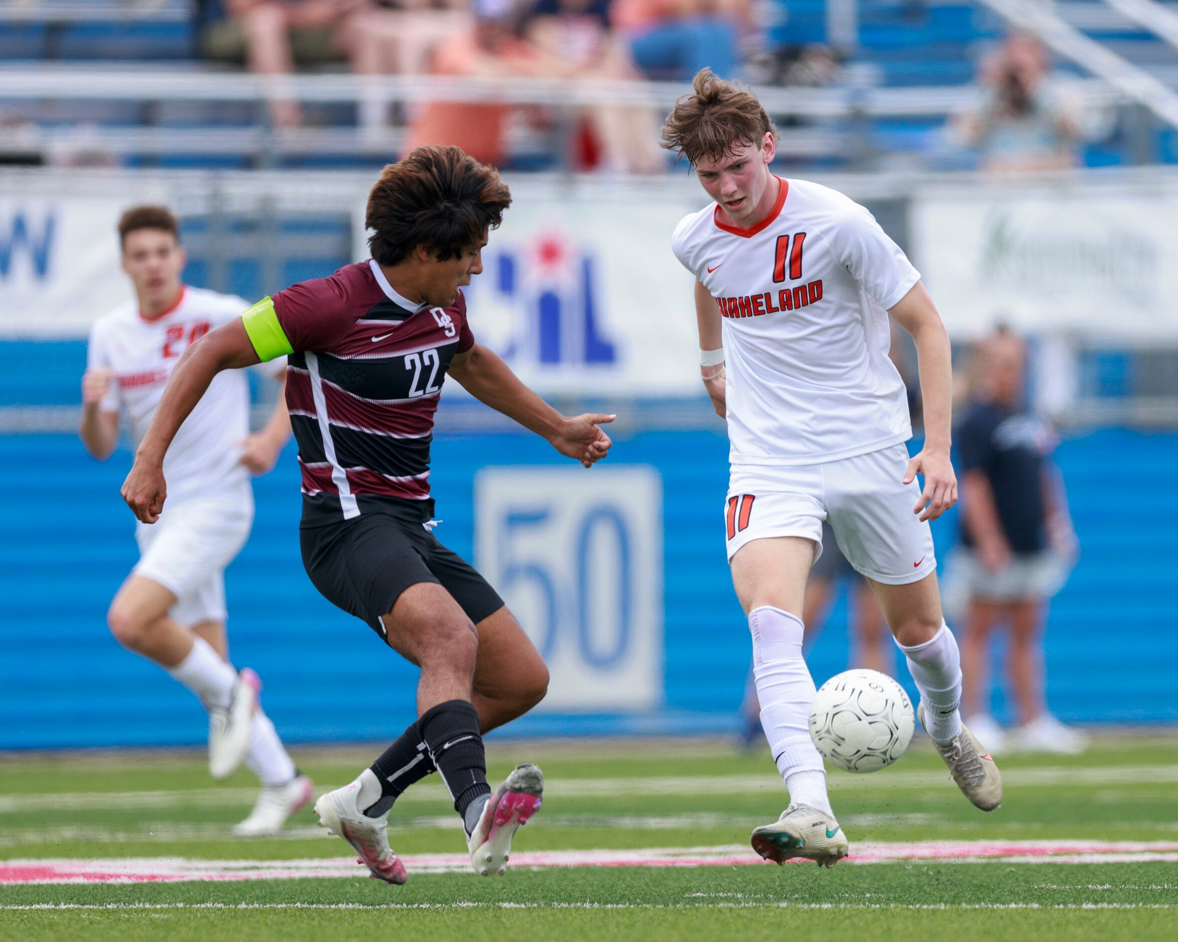 Frisco Wakeland forward William Heidman (11) dribbles the ball past Dripping Springs...