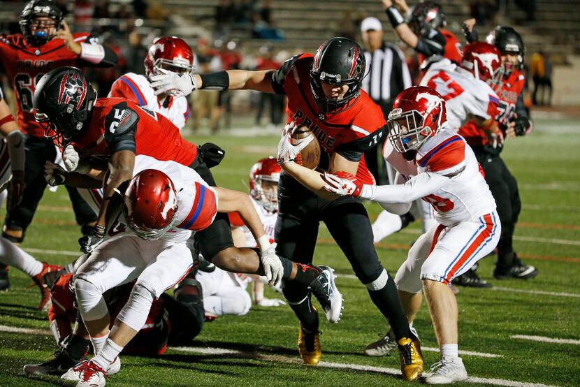 Colleyville Heritage tight end Drew Sanders (11) scores a late 4th quarter touchdown as...