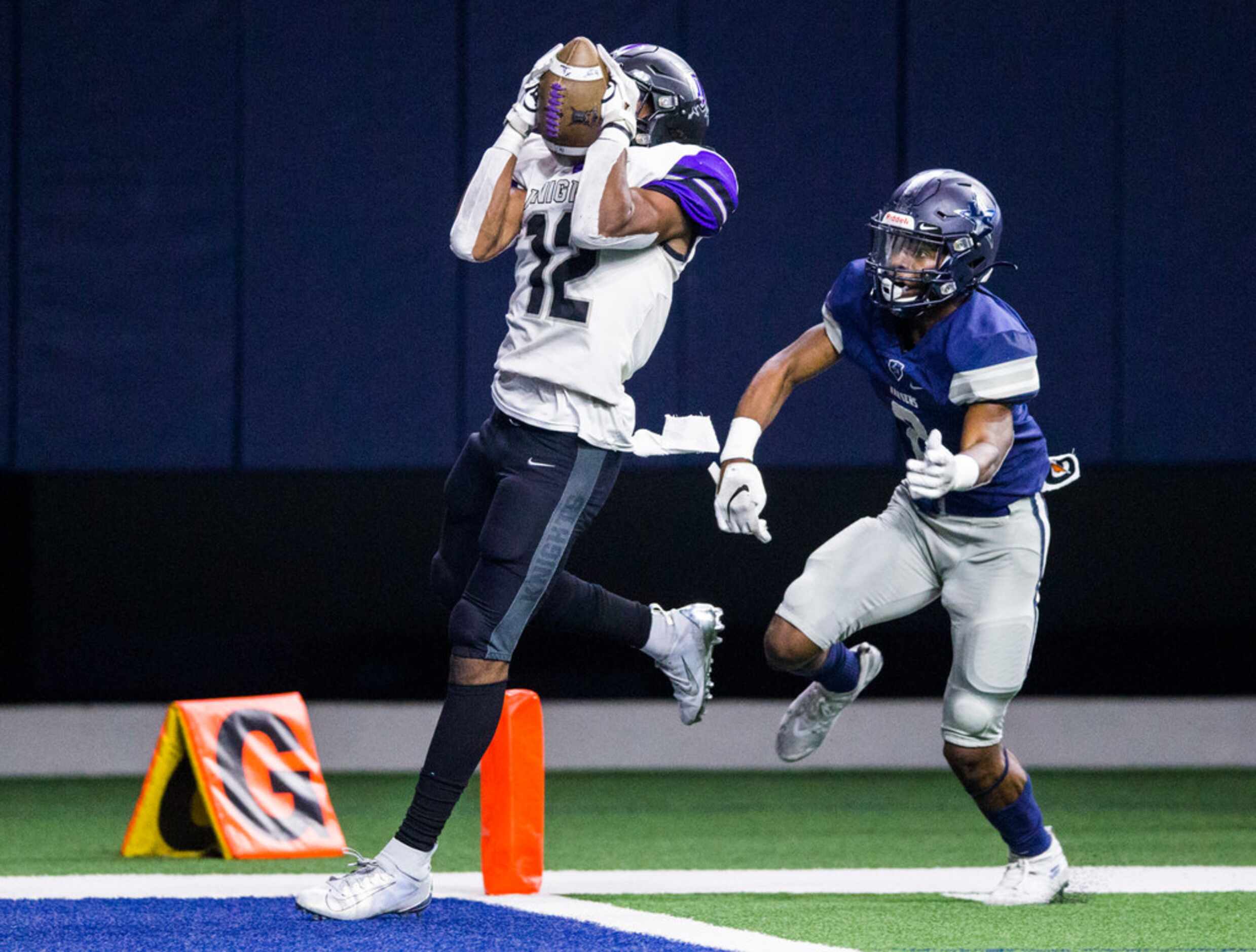 Frisco Independence receiver Zhighlil McMillan (12) catches a pass ahead of Frisco Lone Star...