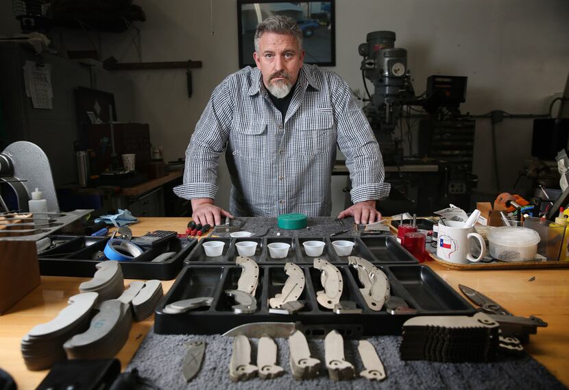 Todd Begg poses for a photograph at his shop where he crafts knives in Dallas.
