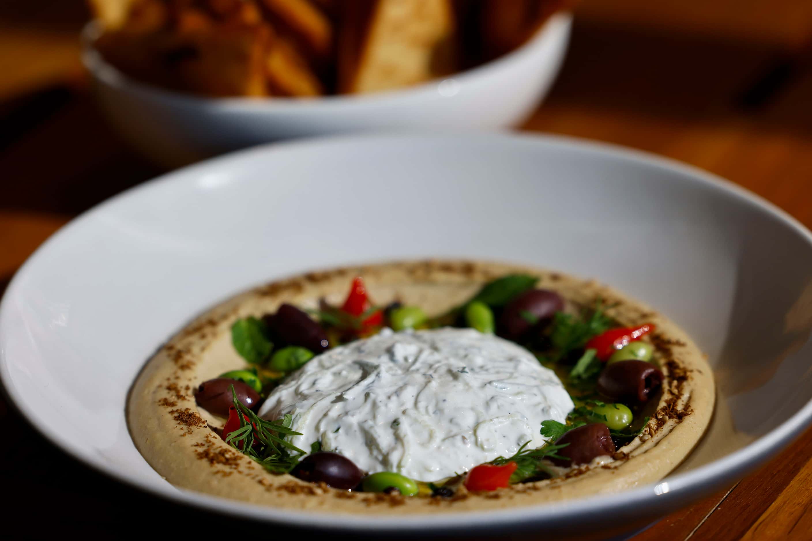 Hummus at Joey is made with tzatziki and dill and is served with pita crisps.